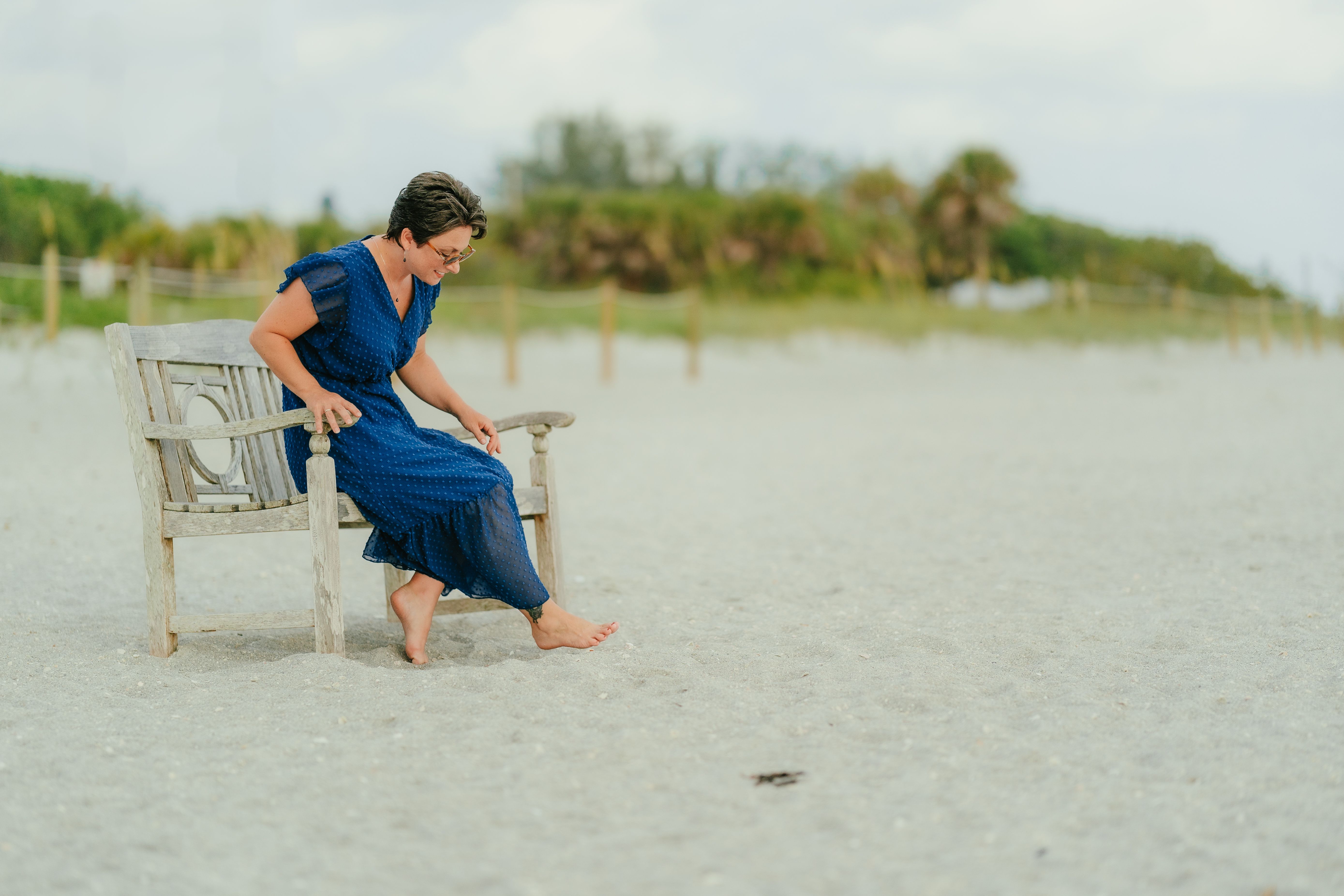 A Woman in a Bikini Standing on the Beach · Free Stock Photo