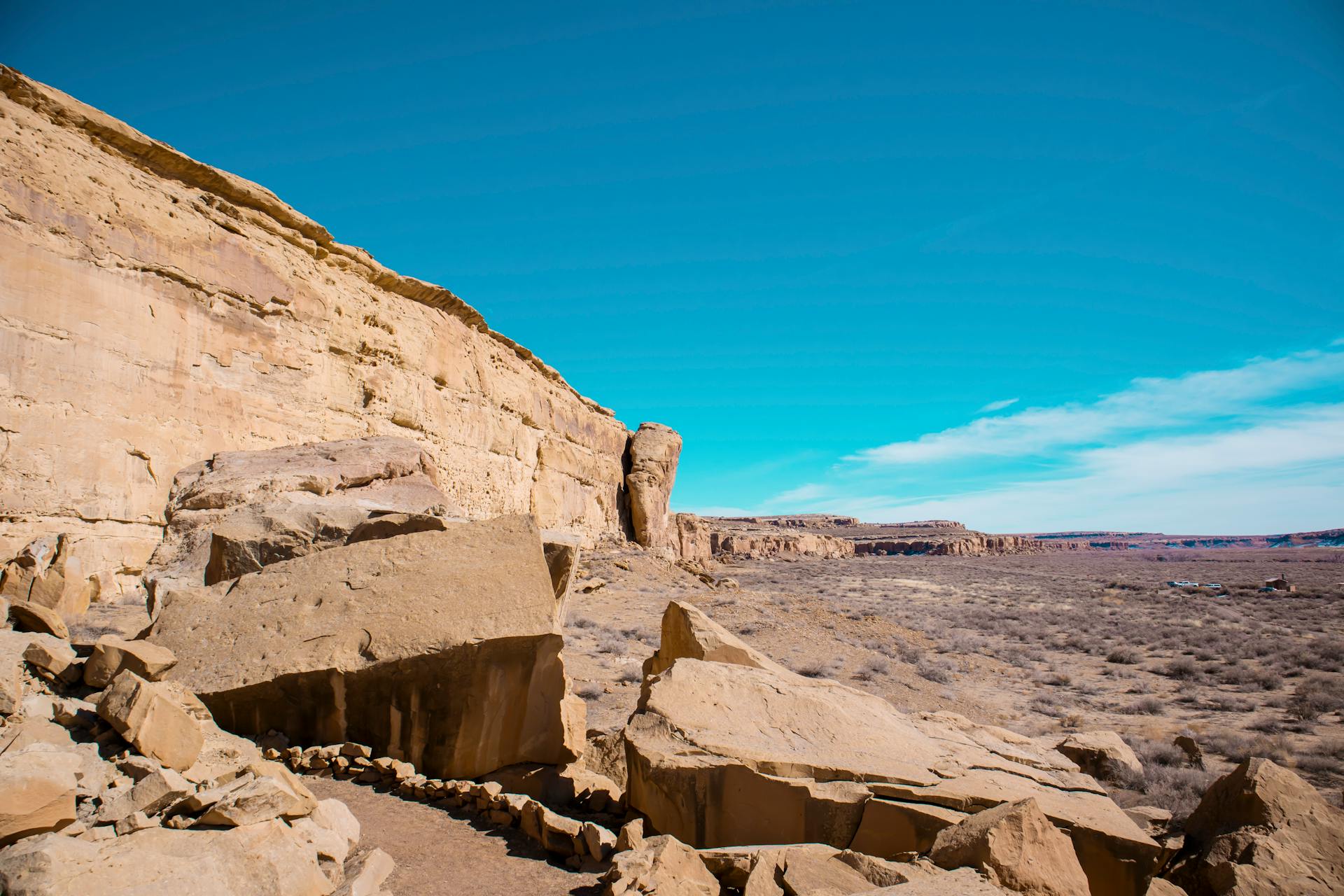 Breathtaking view of sandstone cliffs under a clear blue sky in the New Mexico desert.