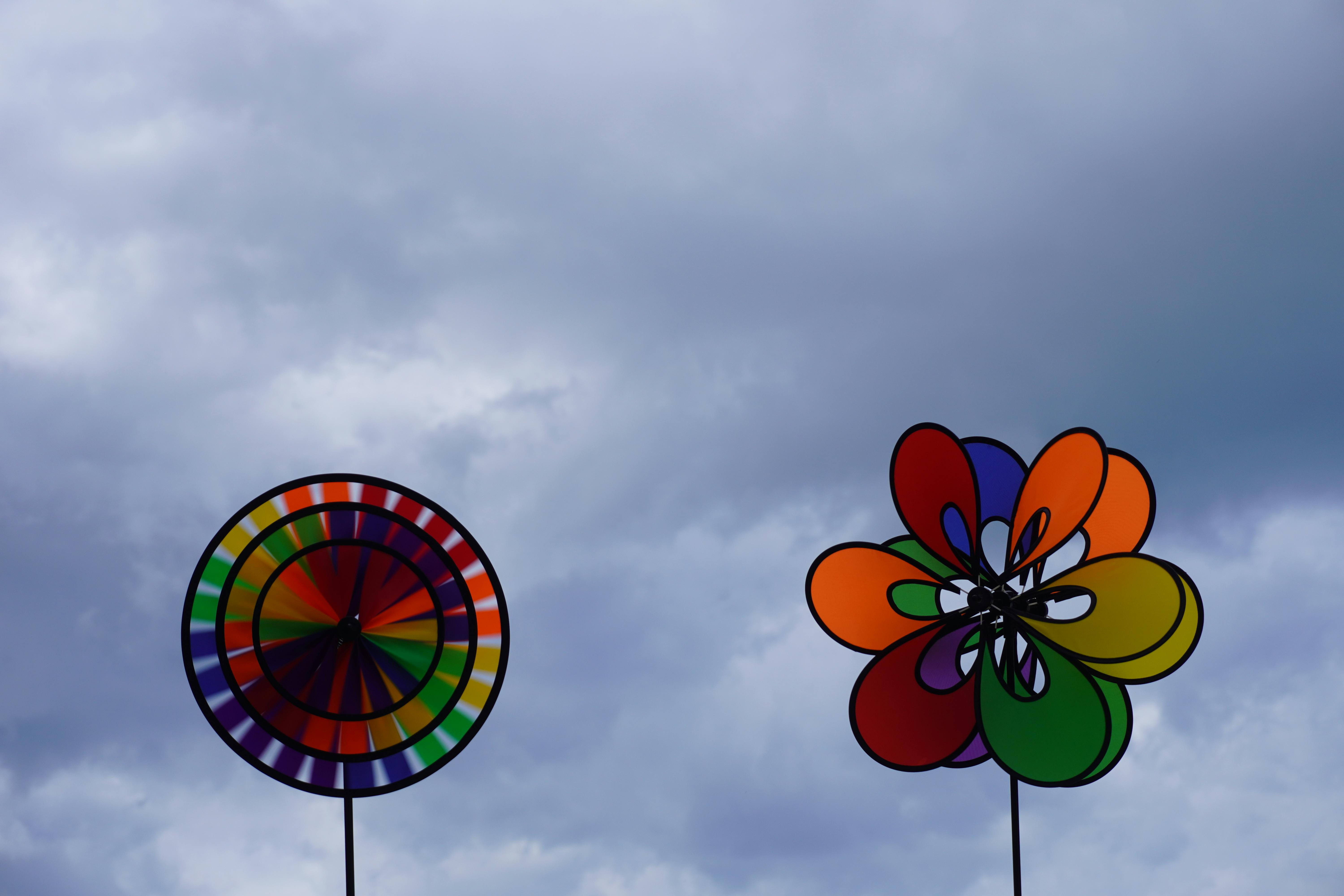 Multi Color Pinwheels Under Blue Sly · Free Stock Photo