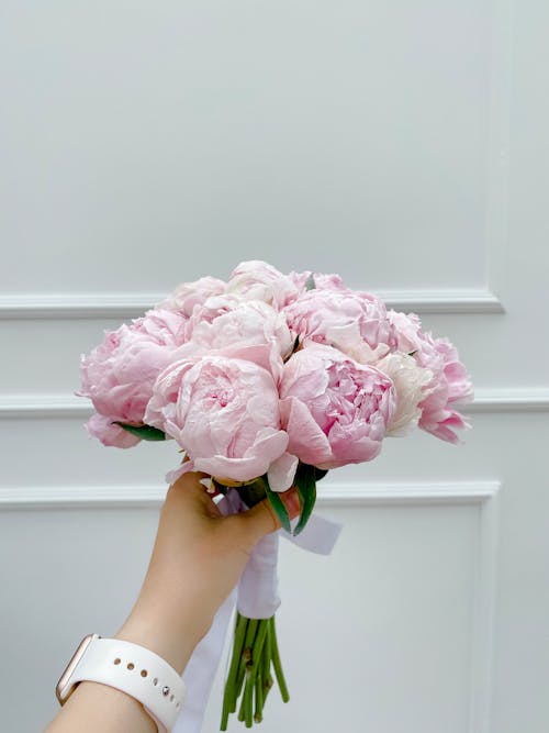 Hand Holding Peony Bouquet