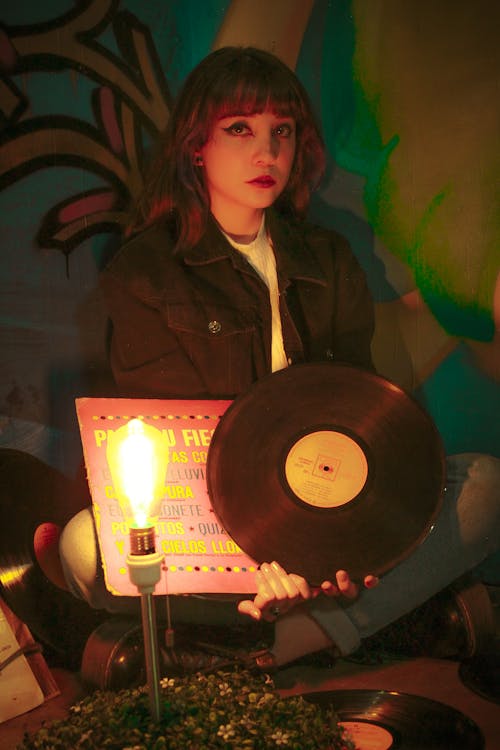Woman Holding a Vinyl Record