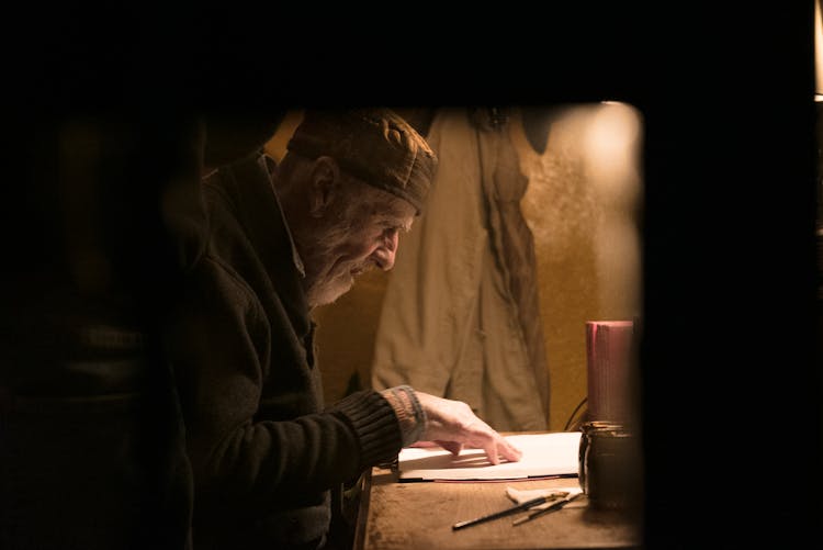 An Elderly Man Reading