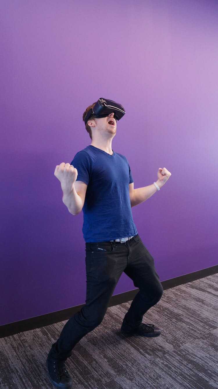 Man Having Thrilling Experience Using VR Headset