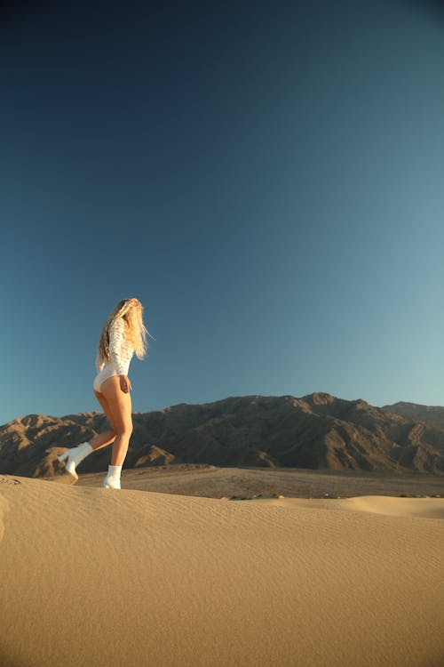 Woman Walking on Desert