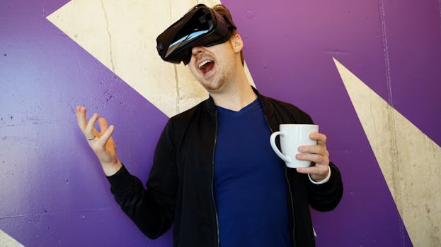 Adult male with VR headset holding coffee mug, expressing excitement, indoors.