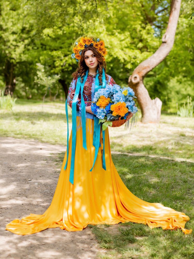 Woman With A Floral Headdress Carrying A Basket Of Flowers