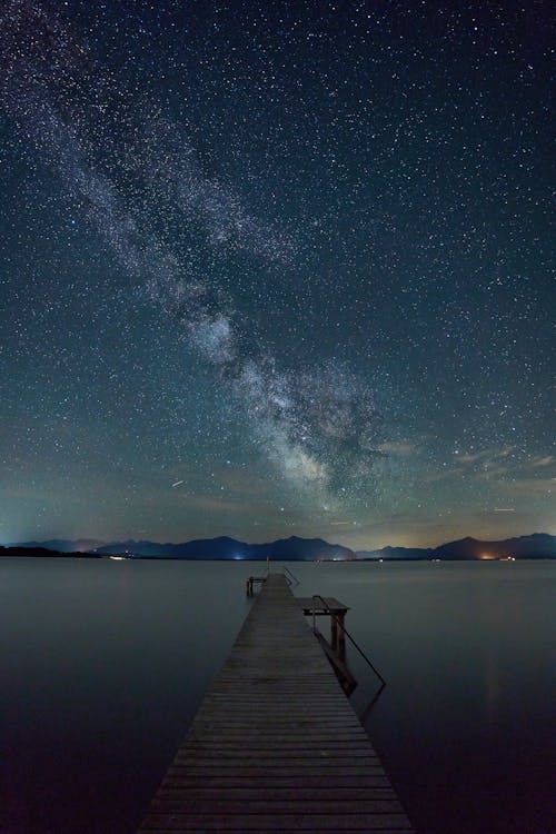 A Lake Near Mountain Under Starry Night · Free Stock Photo