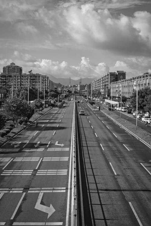 Grayscale Photo of Cars on Roads