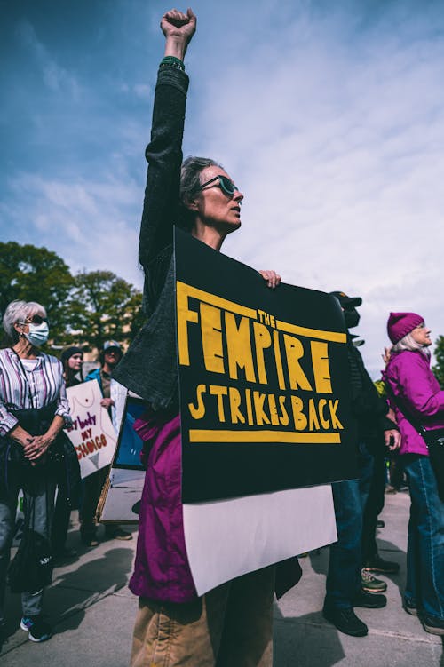 Woman Protesting with Arm Raised