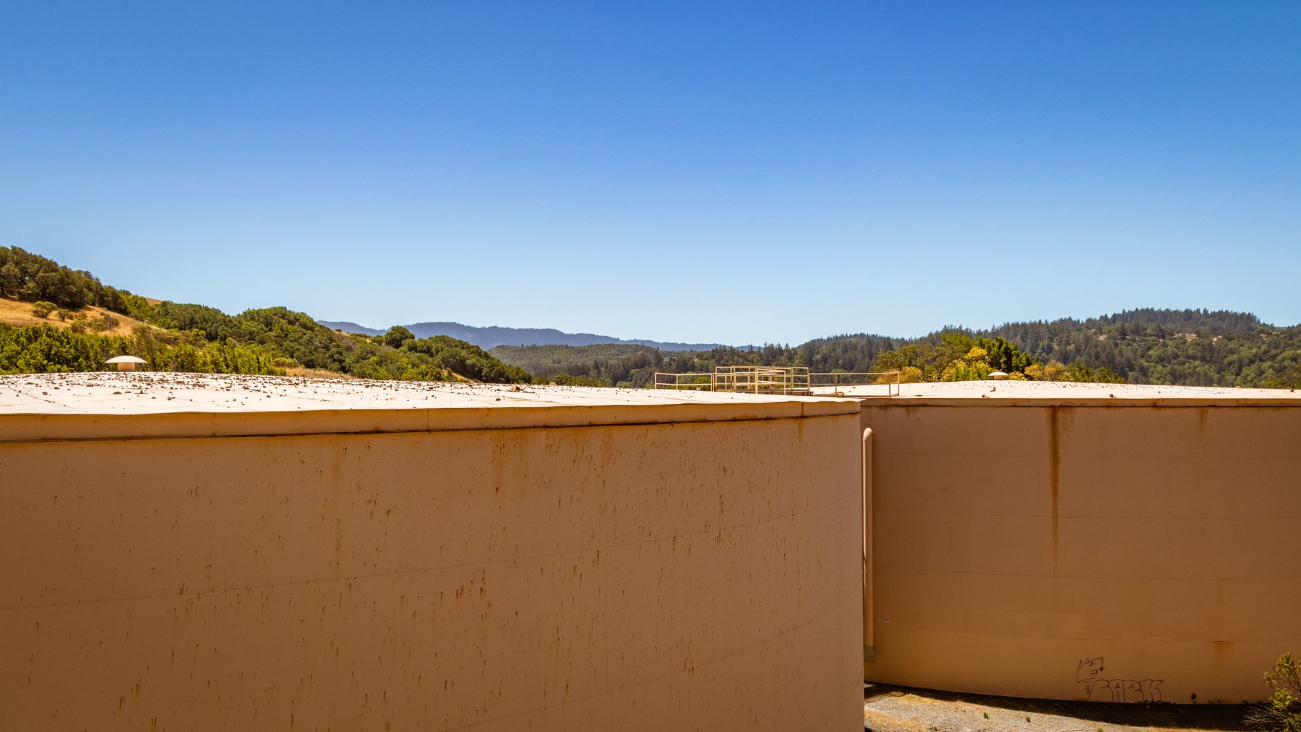 Large-scale cooling towers at a modern facility illustrating AI infrastructure sustainability