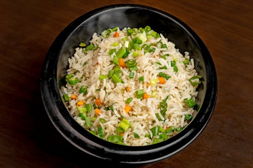 Close-Up Photo of a Black Bowl with Biryani Rice