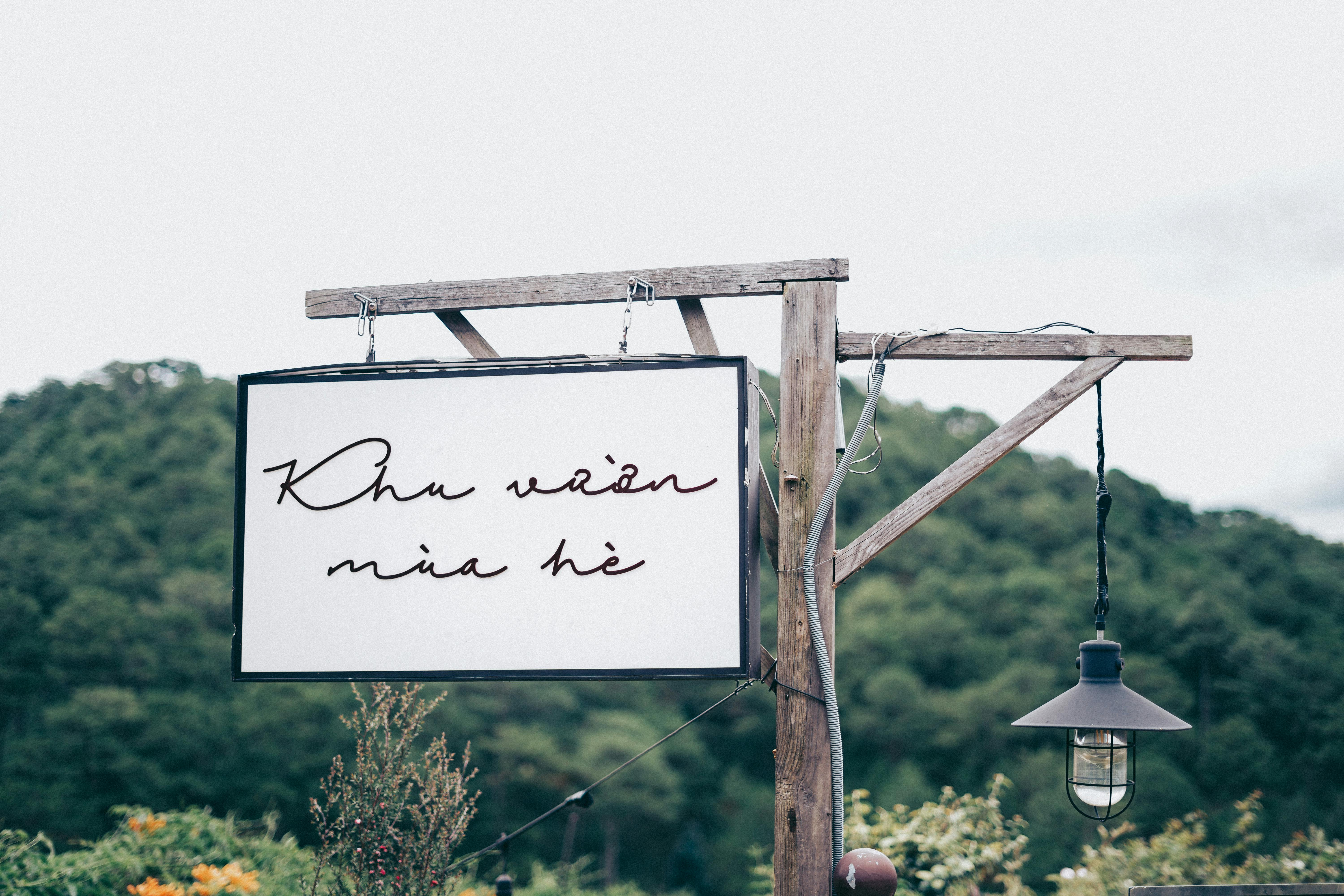 signage and a hanging lamp