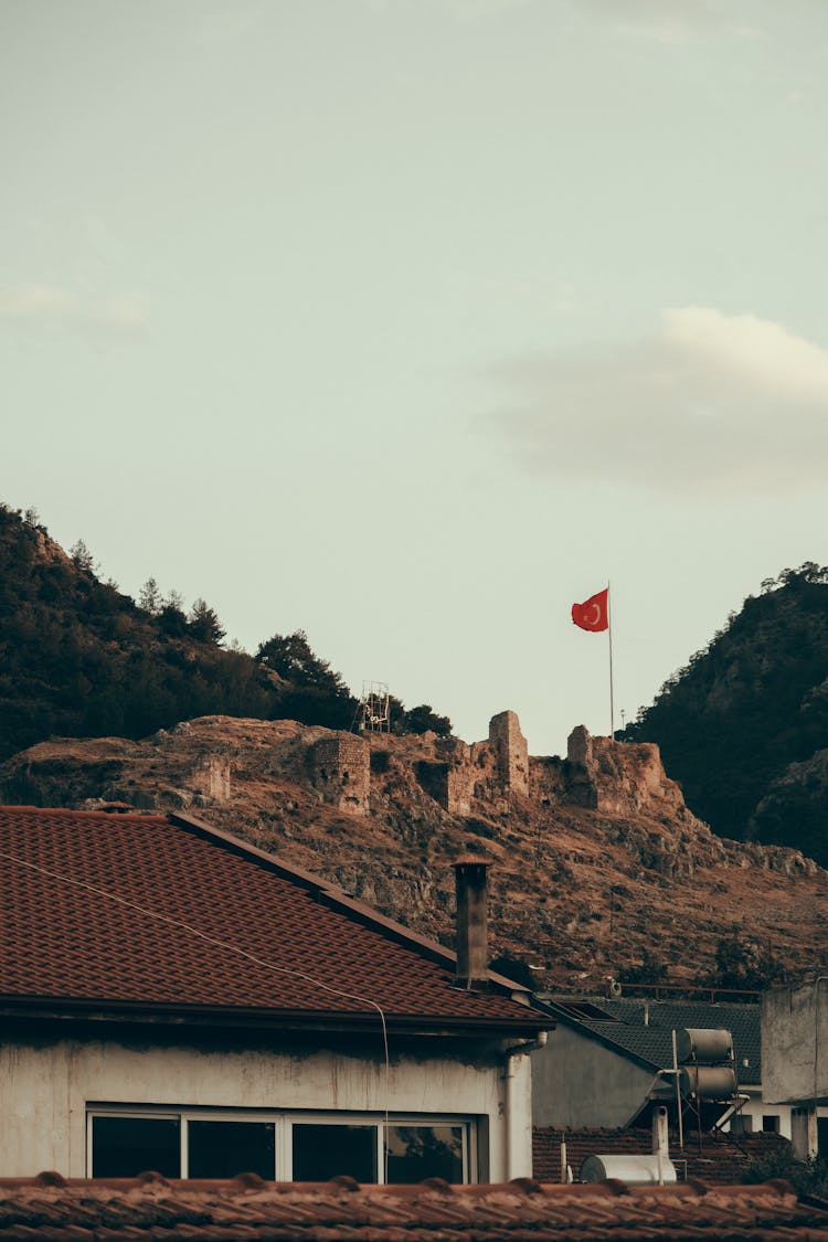 Photo Of A House Near A Turkey Flag