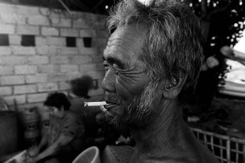 Free Grayscale Photo of an Elderly Man Smoking  Stock Photo