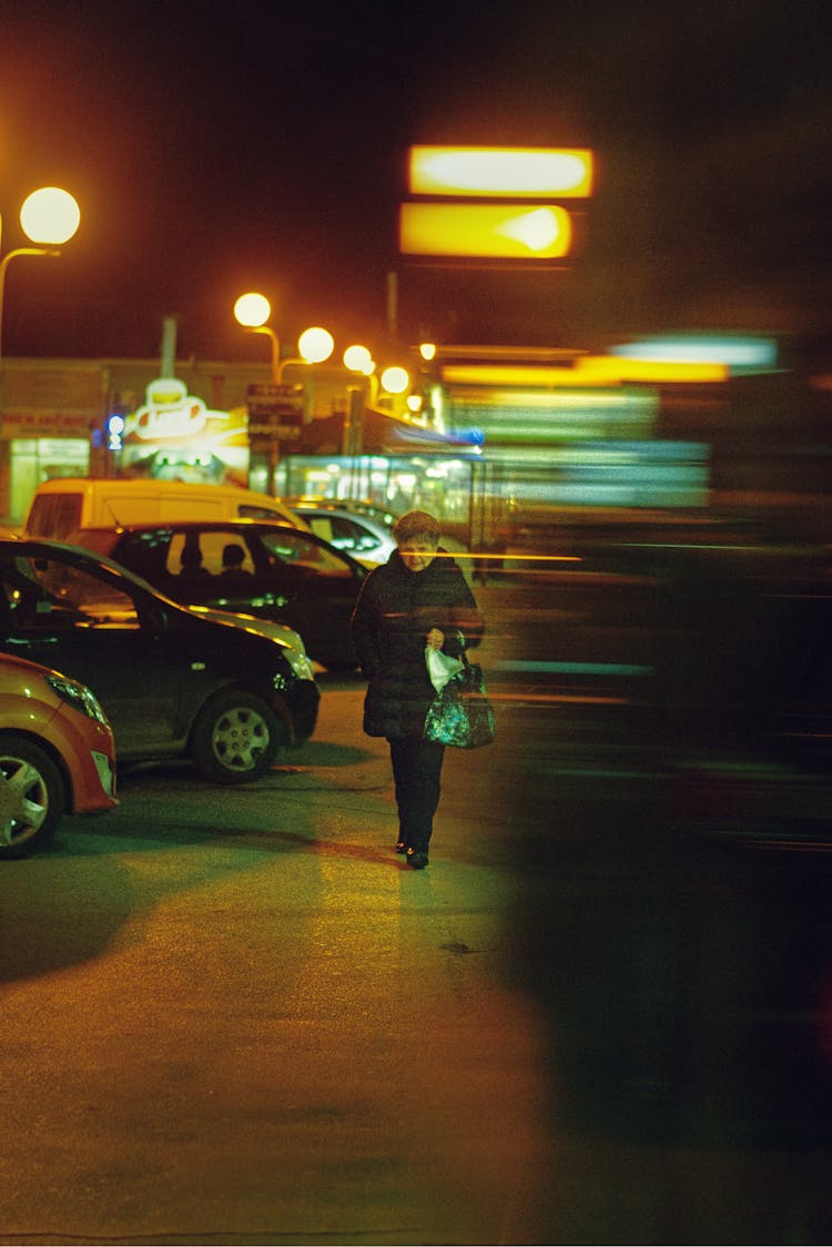 A Woman Walking In A City