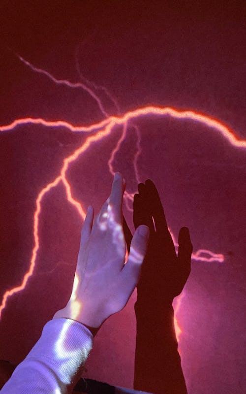 A Person Touching a Lightning on a Wall