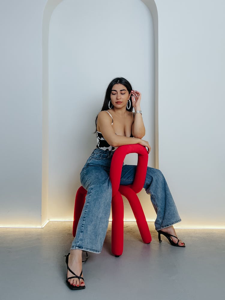 Portrait Of Woman On Red Chair