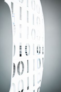 Stylish interior office design featuring an illuminated binary pattern wall, symbolizing modern digital communication.