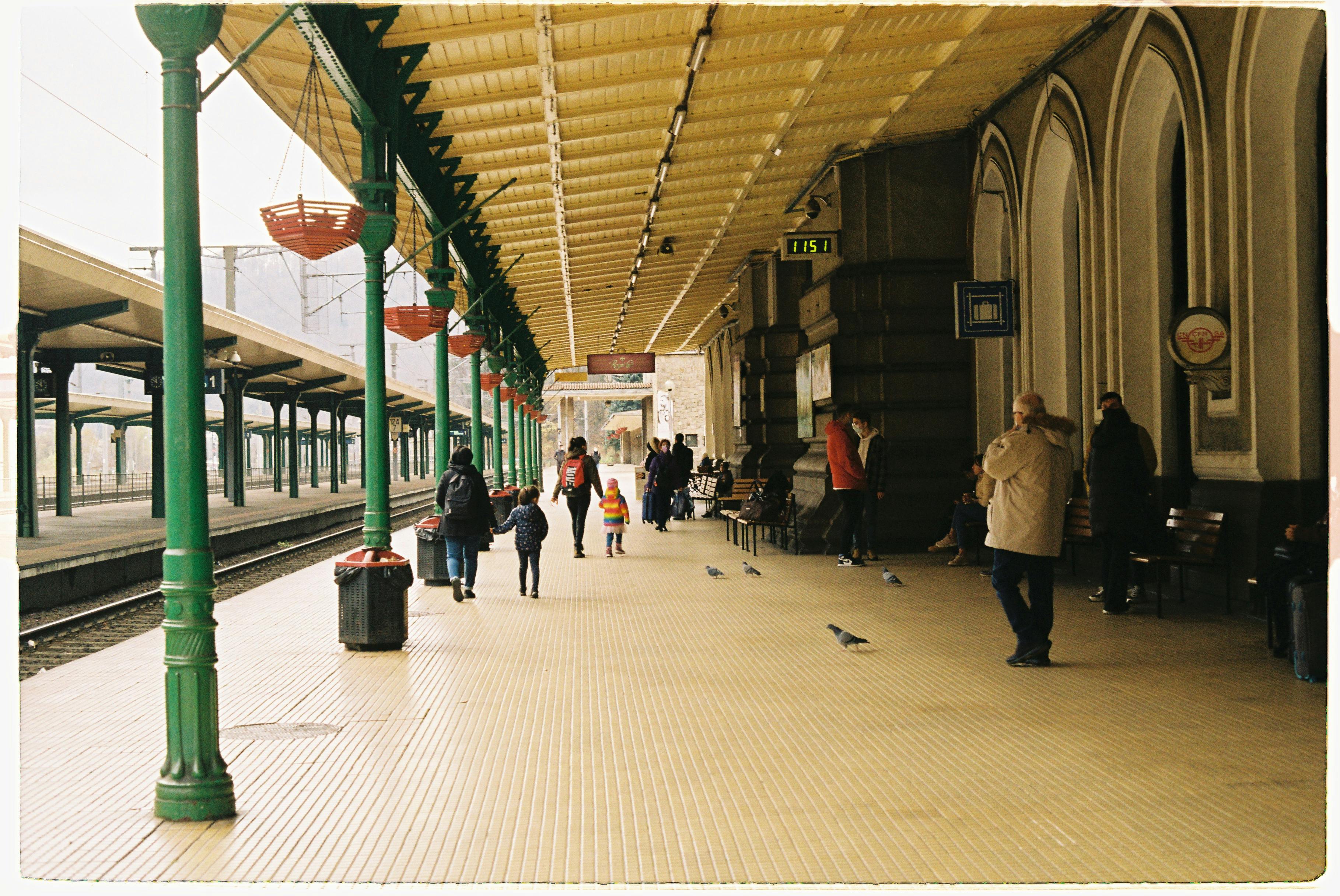 Back View of a Man Waiting at a Train Station · Free Stock Photo