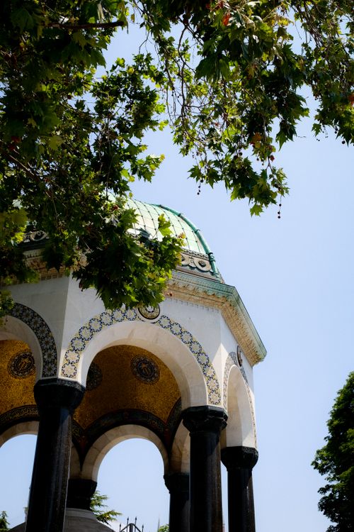 Free A beautiful example of Ottoman architecture featuring a dome, arches, and intricate mosaics. Stock Photo