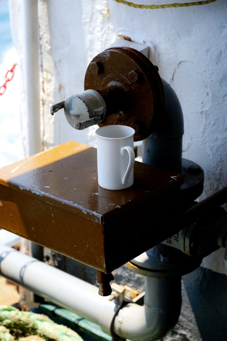 White Mug On Machine