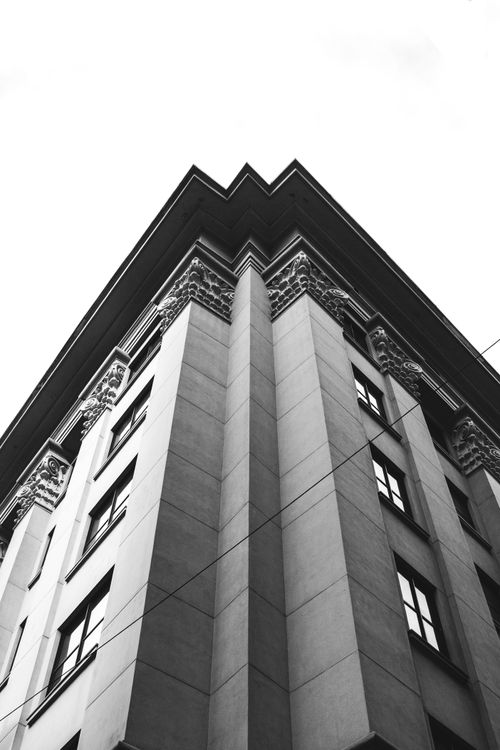 Free Striking low angle view of a city's architectural facade in black and white. Stock Photo
