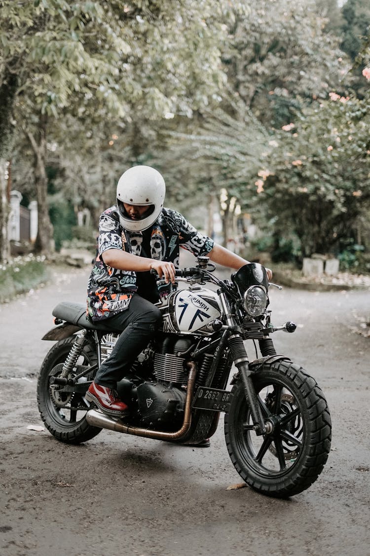 Man On A Motorcycle Looking Down