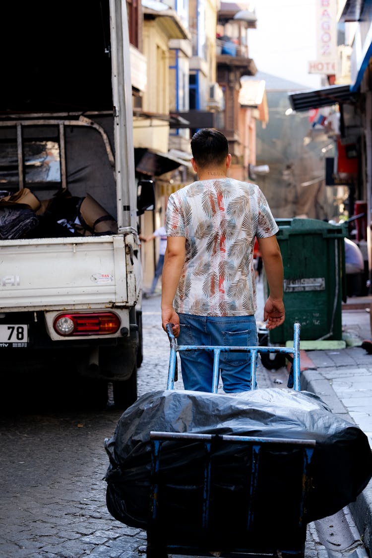 Man Transporting Trash