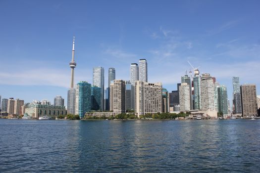 Stunning view of Toronto's skyline with the iconic CN Tower under clear blue skies.