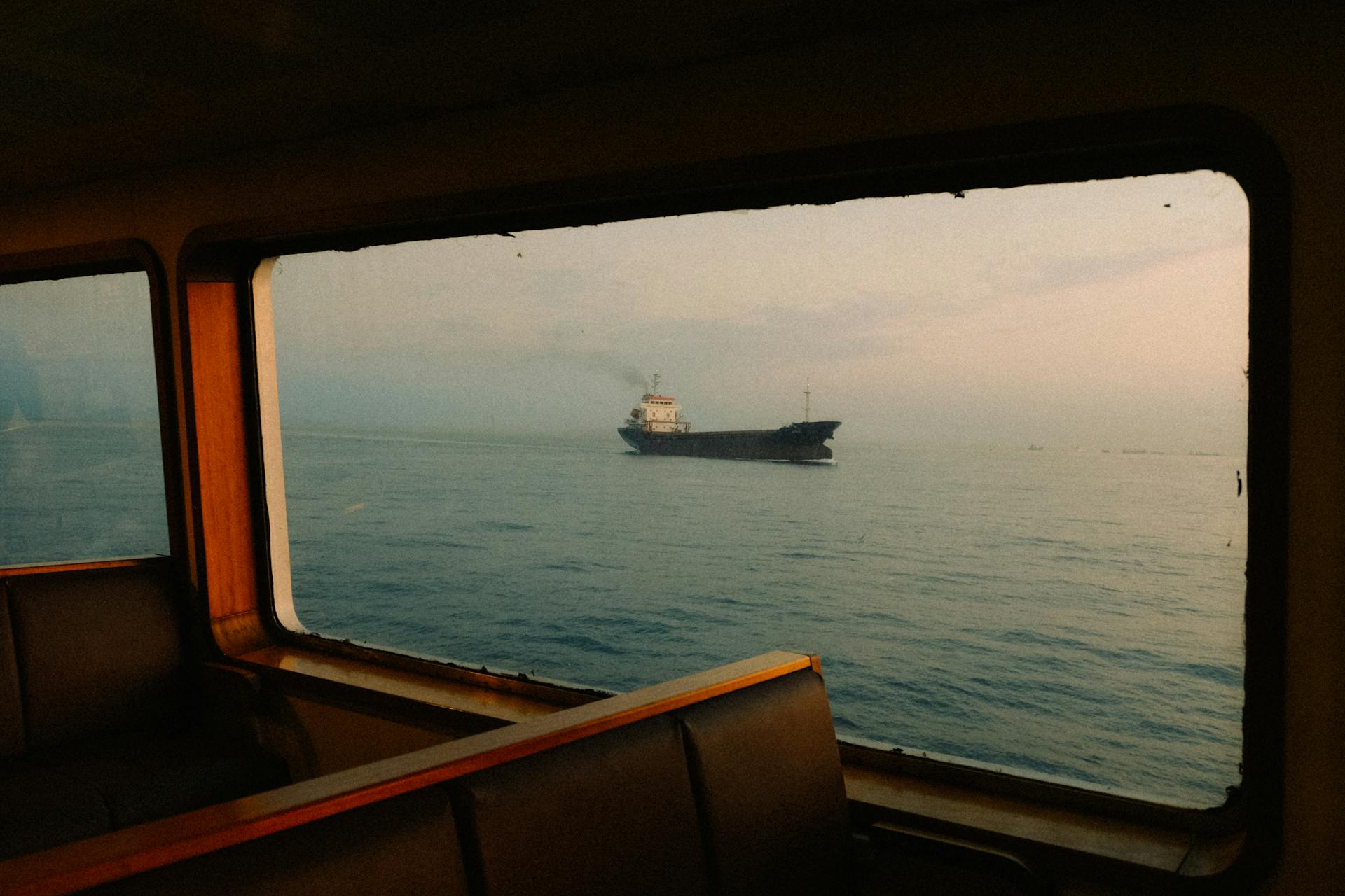 Photo of a Container Ship trough a Window