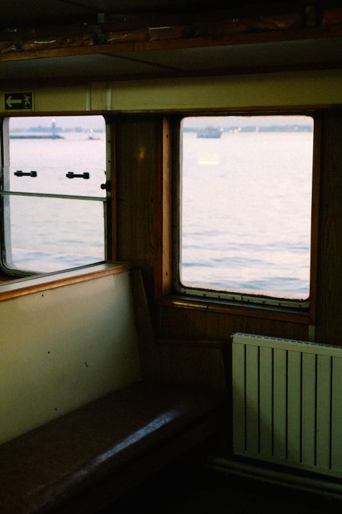 Free Interior view of a boat cabin with a serene sea view through the window. Stock Photo