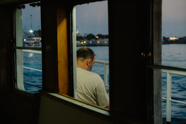 Man On Boat On Sea