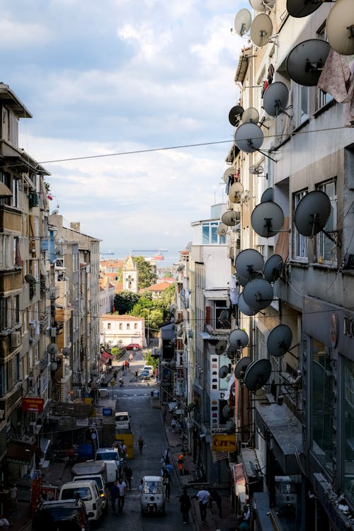 Photo of a Cityscape and a Building with Satellite Dishes