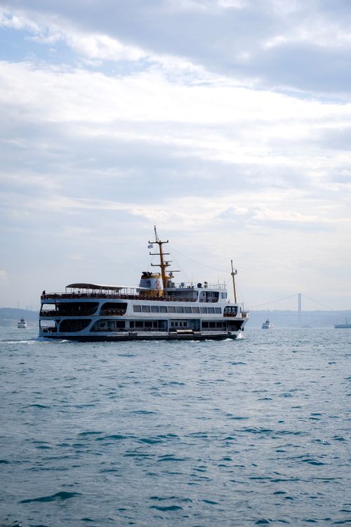 Free A stunning cruise ship sailing on the open sea with a clear sky in the background. Stock Photo