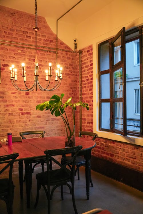 Chandelier Over a Wooden Dining Table 