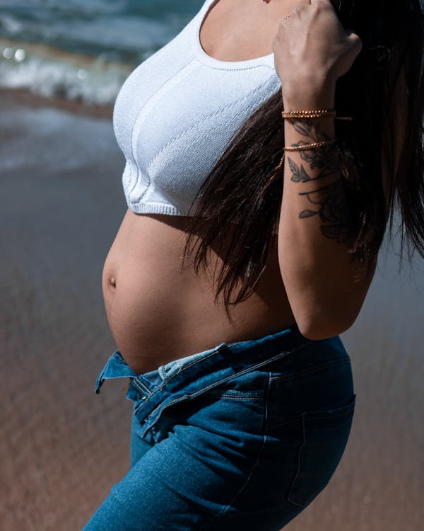 Free Pregnant Woman on the Beach Stock Photo