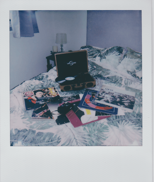 Free Collection of Vinyl Records and a Record Player on a Bed Stock Photo