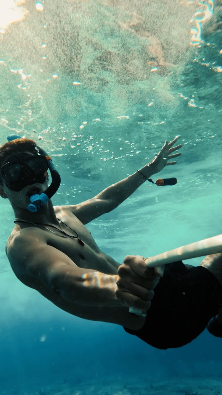 A Man Snorkeling Underwater