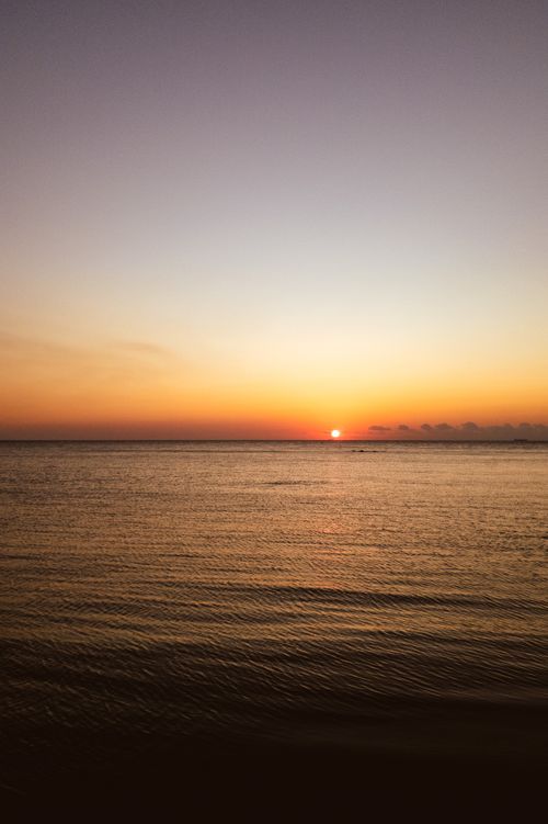 Free A tranquil sunset view over the sea in Yalova, Türkiye, showcasing vibrant hues and calm waters. Stock Photo