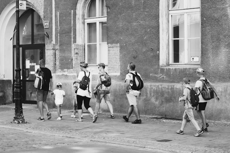 People Walking On Street Near Building