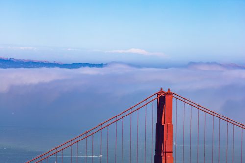 Free Stunning view of the Golden Gate Bridge emerging through fog. Stock Photo