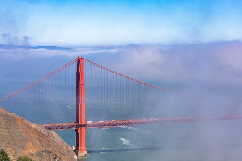 Free Aerial view of the iconic Golden Gate Bridge surrounded by mist and ocean in San Francisco. Stock Photo