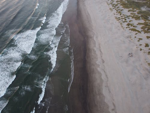 Aerial Shot of Ocean Waves on a Shore