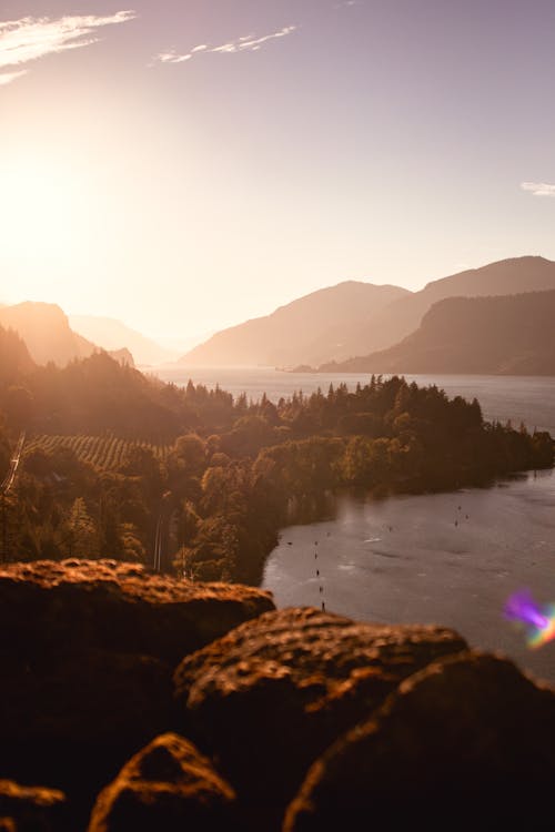 Sunlight Over Natural Landscape With River