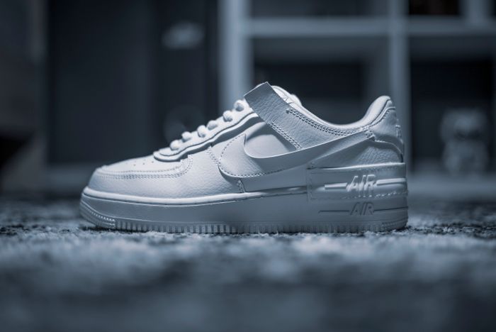 White athletic shoe photographed by HamZa NOUASRIA on Pexels