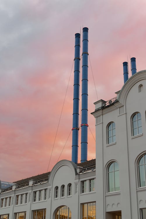 Photo of an Old Industrial Buildings with Chimneys