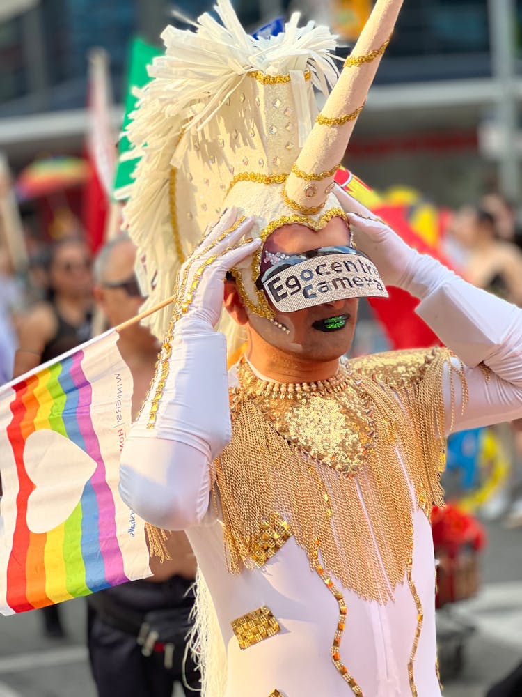 Man In A Golden Unicorn Costume On A Parade