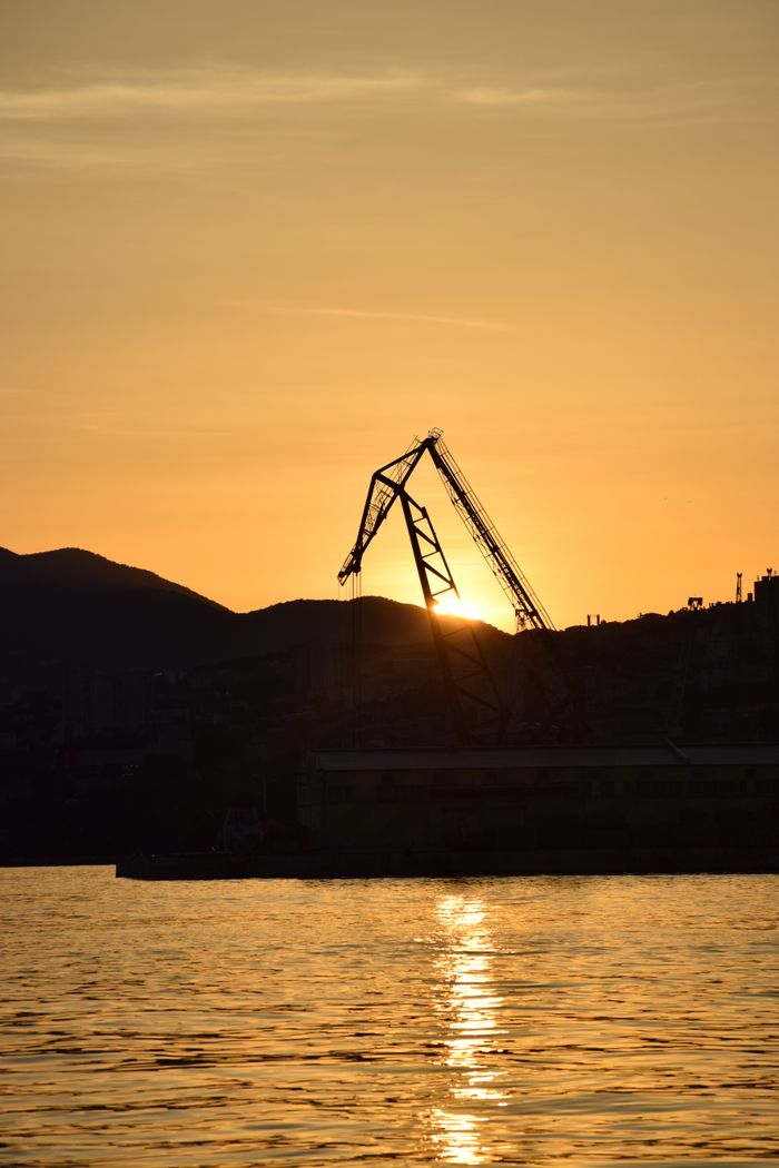 Crane silhouetted over the Meridian commercial tower site