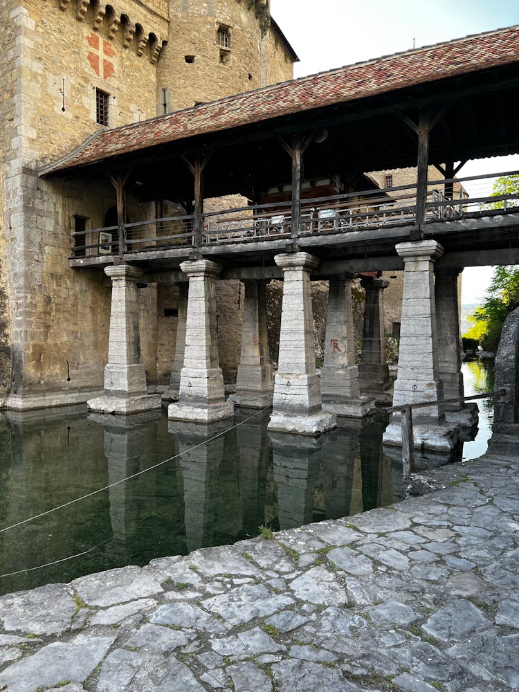 Stone Bridge On Pillars To Old Brick Castle