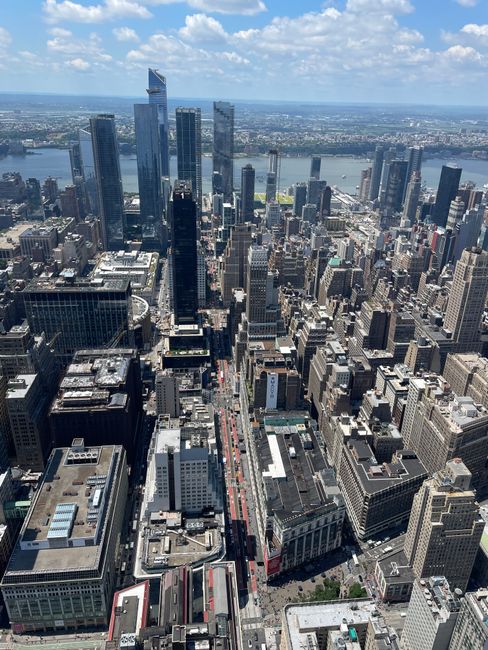Stunning aerial view of New York City's skyscrapers with the Hudson River in the background.